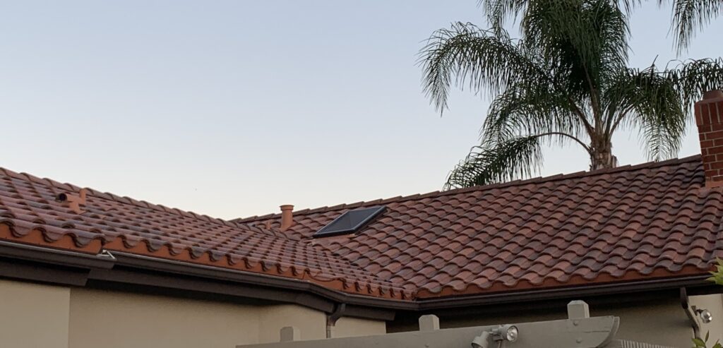 A roof with a solar panel on it